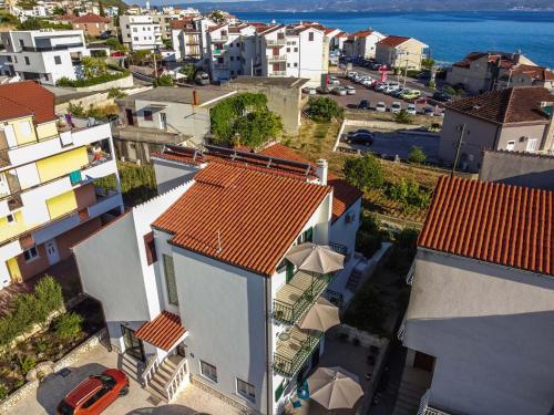 an aerial view of a city with houses and the ocean at Ve & Ki in Podstrana