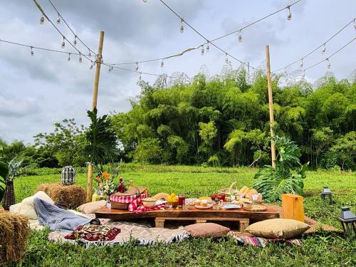 a picnic table in the middle of a field at El Percal Hacienda Hotel in Montenegro
