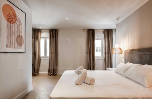 Posteľ alebo postele v izbe v ubytovaní Idyllic and spacious apartment with parking - Center by REMS