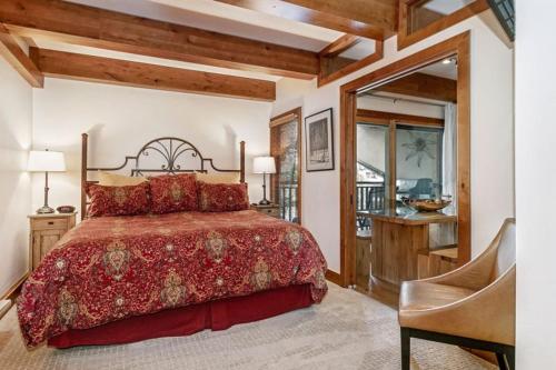 a bedroom with a bed and a desk and a chair at 1 Bedroom Antlers Vacation Rental With Incredible Slopeside Views And Just A Short Walk To Gondola And Lionshead Village in Vail