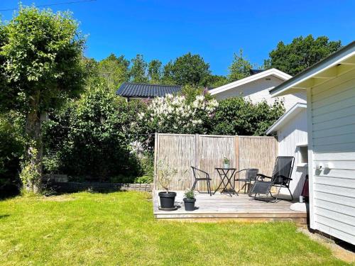 a patio with two chairs and a table in a yard at 3 person holiday home in UDDEVALLA-By Traum in Uddevalla
