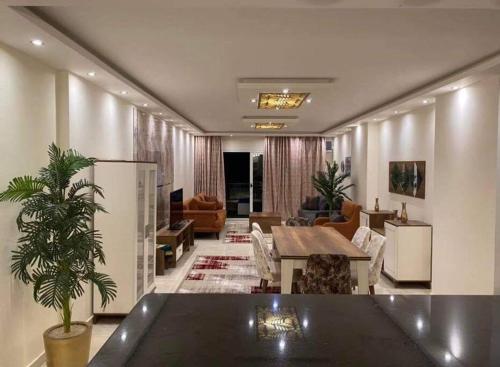 a living room with a table and a couch at Unique Seaview 3-Bedroom Apartment in Alexandria