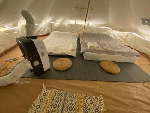 Ein Bett oder Betten in einem Zimmer der Unterkunft Hoang Indian Tent Camping
