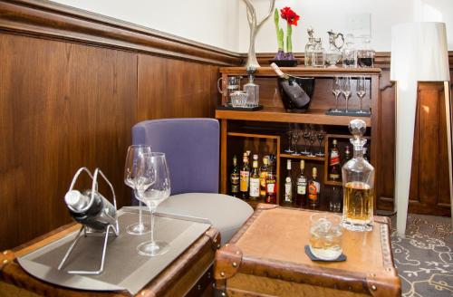a room with two wine glasses on a table at Park Villa Hotel in Wuppertal