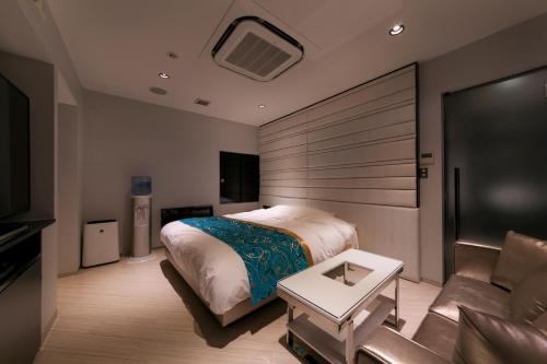 Tempat tidur dalam kamar di HOTEL ELDIA (Adult Only)