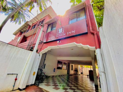 a building with a sign that reads park palms inn at Yal's Town Inn in Jaffna