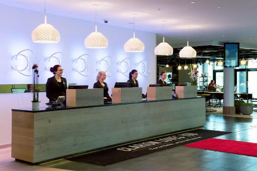 a group of people sitting at a reception desk at Clarion Hotel Energy in Stavanger