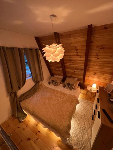 Postel nebo postele na pokoji v ubytování WoodMood