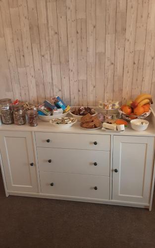 a white dresser with food on top of it at Sea Lodge B&B in Durrus