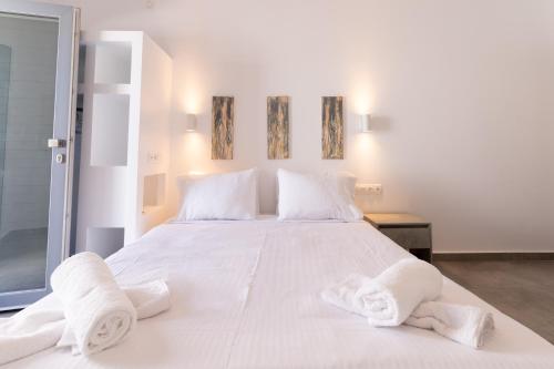 Ένα ή περισσότερα κρεβάτια σε δωμάτιο στο Bedspot Apartments Astipalaia