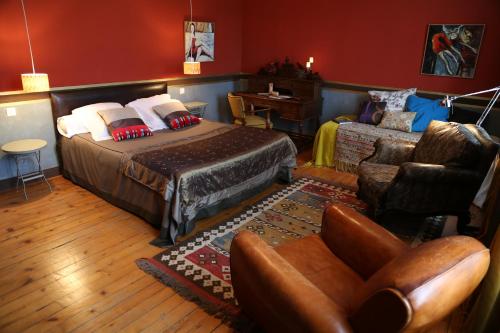 En eller flere senge i et værelse på Le Grand Duc