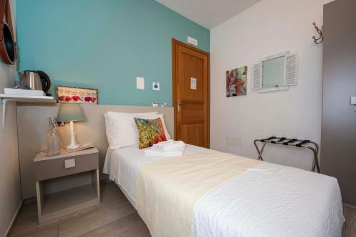 Ένα ή περισσότερα κρεβάτια σε δωμάτιο στο B&B Pousada Rio Aosta-servizi di Bed and breakfast