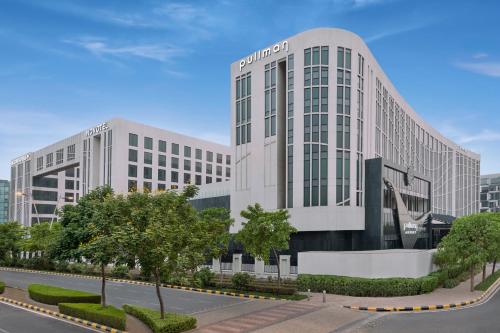 a rendering of a building in a city at Pullman New Delhi Aerocity in New Delhi