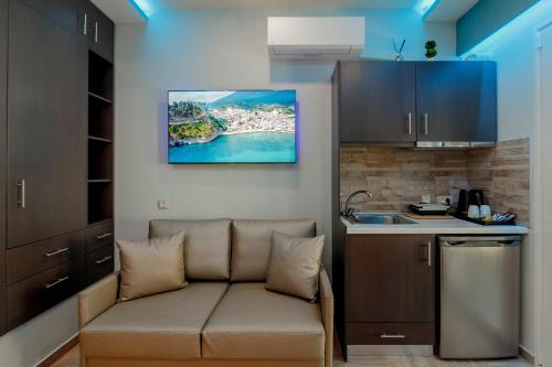 a living room with a couch in a kitchen at Dim House in Parga