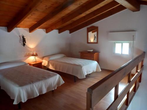 Un pat sau paturi într-o cameră la Las Casas de las Flores
