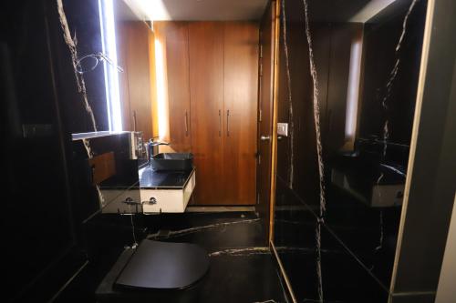 a small bathroom with a sink and a toilet at IP Royal Hotel - New Delhi in New Delhi