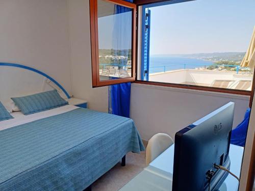Postel nebo postele na pokoji v ubytování Hotel Degli Ulivi