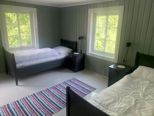 מיטה או מיטות בחדר ב-Engen Gård