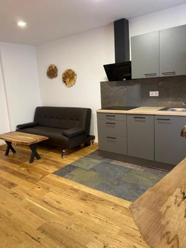 a living room with a couch and a table at Hotel-Gasthof Zur Post in Velburg