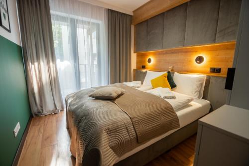 Posteľ alebo postele v izbe v ubytovaní Apart Invest Centrum Park 18