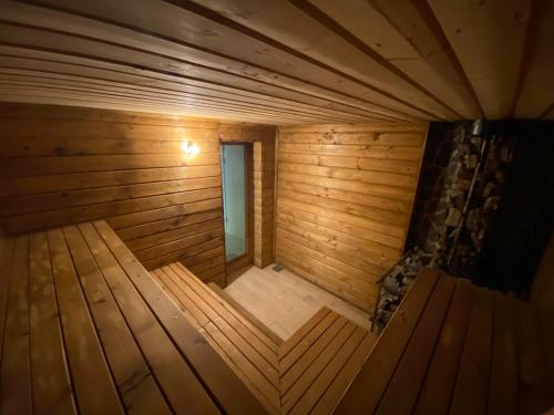 an overhead view of a small wooden sauna at 4 Mountains Hotel in Bystrets