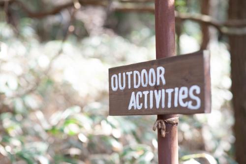 a sign that says outdoor activities on a pole at Rokko Outdoor Station FOTON in Kobe