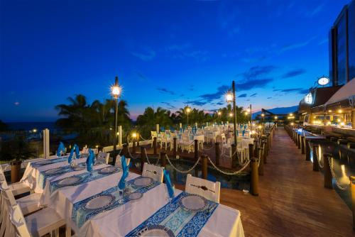 a table set up for a wedding on a dock at Kamelya Aishen Club & Aqua Ultra All Inclusive Kids Concept in Side