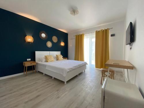 En eller flere senge i et værelse på Casa Ayan