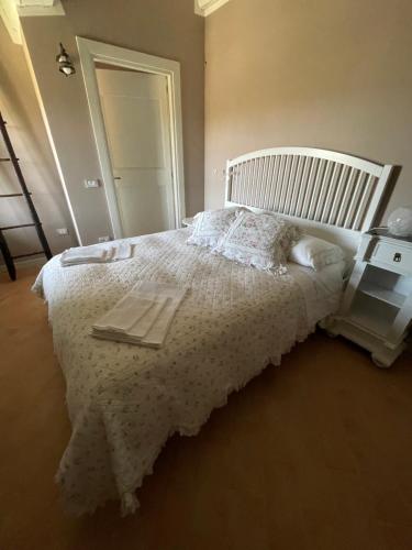Postel nebo postele na pokoji v ubytování B&B Cascina Artemisia