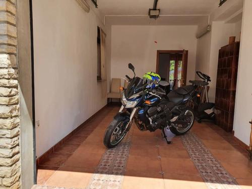 a motorcycle parked in a room with a hallway at Kuca za odmor Juraj - Apartmani Barsic in Duga Resa