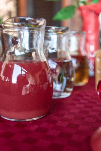 a glass jar filled with liquid sitting on a table at B&B La veranda di Tatta in Agrigento