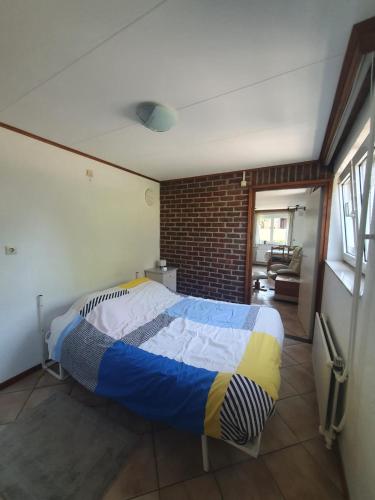 Postel nebo postele na pokoji v ubytování 't Schoenmakershuisje