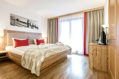 Posteľ alebo postele v izbe v ubytovaní Sporthotel by Alpenlodge