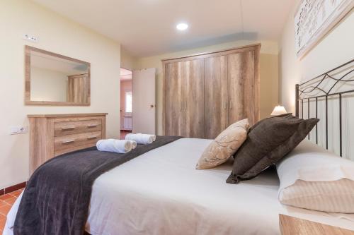 Una cama o camas en una habitación de Orillas del Turia