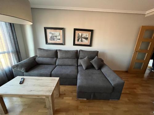 a living room with a couch and a coffee table at AVA-2 in Arévalo