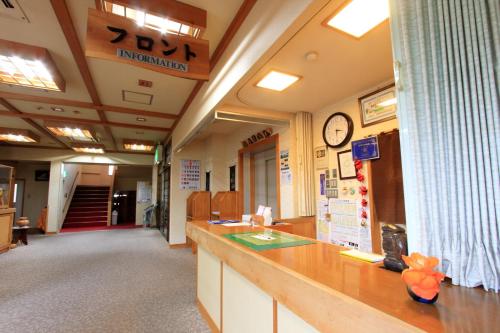 a waiting room of a hospital with a reception counter at Yanagi No Yu in Aomori