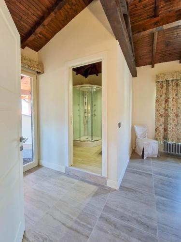 an empty room with a large glass door in a house at Villa Sarchi in Grantola