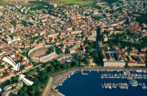 an aerial view of a city with a harbor at Soba Arena in Pula