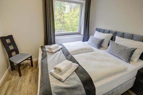 Cama o camas de una habitación en Pension Hygge am Hafen