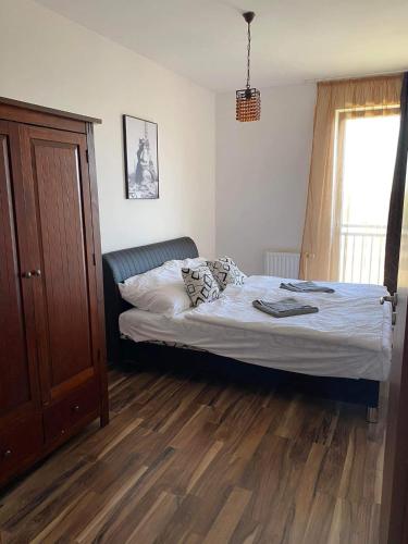 Postel nebo postele na pokoji v ubytování Nikola Apartman