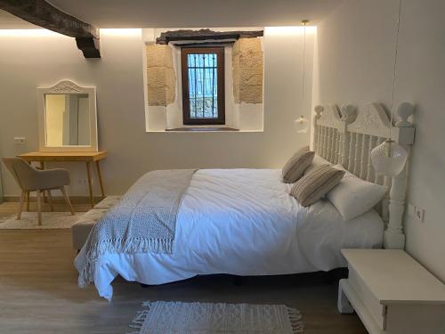 Postel nebo postele na pokoji v ubytování Posada La Lomba