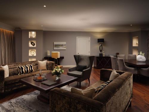 a living room with couches and a dining room at Lyrath Estate in Kilkenny