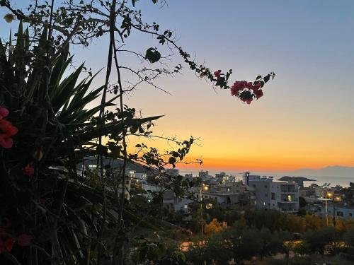 a view of a city at sunset at Summer Dreams in Ksamil