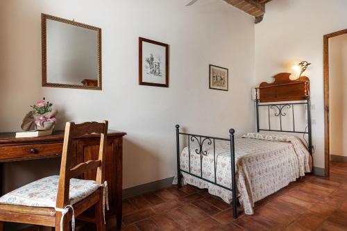 Ένα ή περισσότερα κρεβάτια σε δωμάτιο στο Agriturismo Montalbino