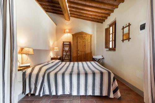 Ένα ή περισσότερα κρεβάτια σε δωμάτιο στο Agriturismo Montalbino