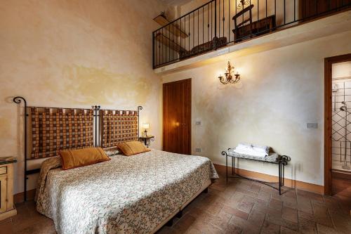 Ένα ή περισσότερα κρεβάτια σε δωμάτιο στο Agriturismo Montalbino