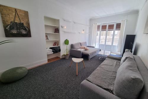 a living room with a couch and a chair at The zenitude of Shepherds #DO in Grenoble