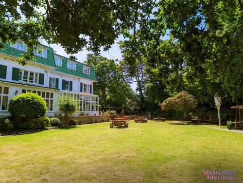 a large yard in front of a large house at The Grove Hotel in Bournemouth