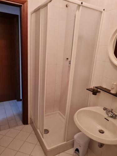 a bathroom with a shower and a sink at La casina di Rio Grande in Grosseto