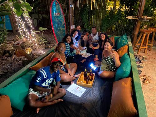 a group of people sitting on an inflatable play structure at The Mudhouse Hostel Mompiche in Mompiche